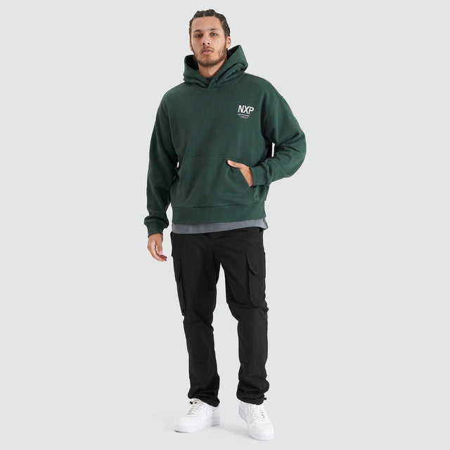 Model Wears Platinum Heavy Box Fit Hoodie Pine Grove Hoodies in Green - Image 4