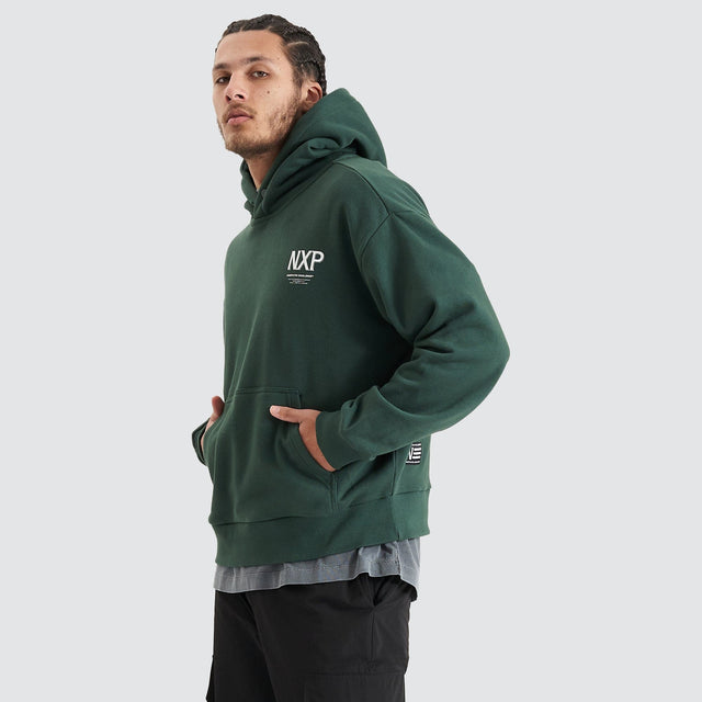 Model Wears Platinum Heavy Box Fit Hoodie Pine Grove Hoodies in Green - Image 7