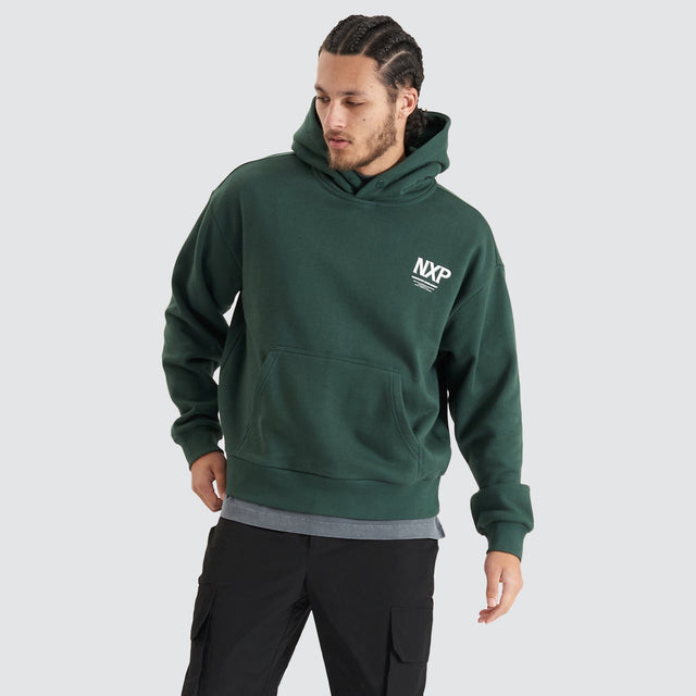 Model Wears Platinum Heavy Box Fit Hoodie Pine Grove Hoodies in Green - Image 1