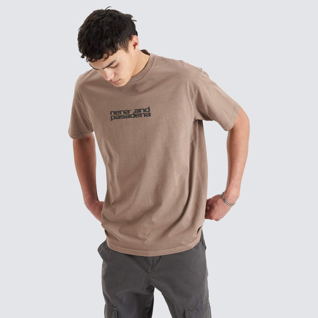 Model Wears Post-Industrial Heavy Box Fit Tee Pigment Bark T-Shirts in Brown - Image 1