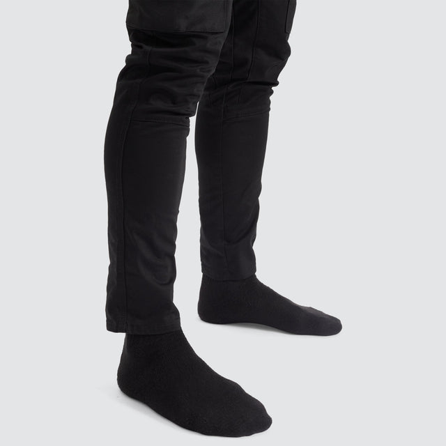 Model Wears Precision Slim Fit Pant Black Pants in Black - Image 12