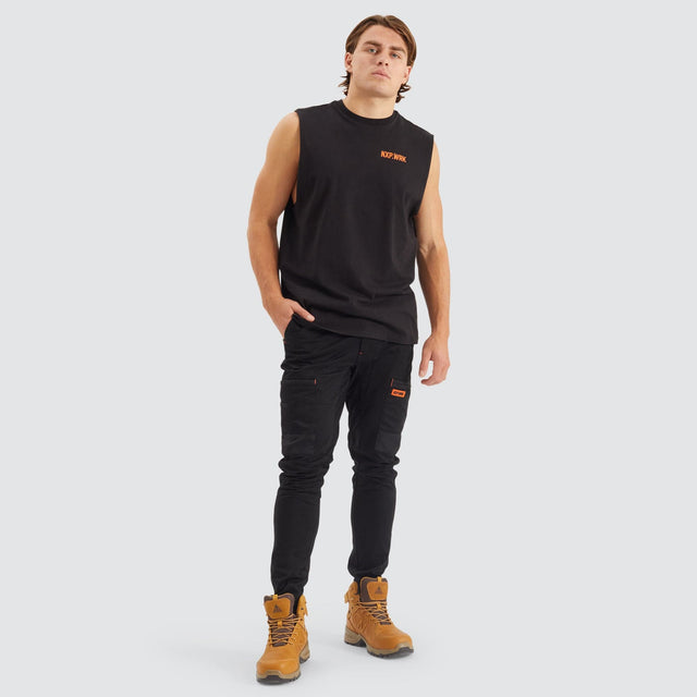 Model Wears Precision Slim Fit Pant Black Pants in Black - Image 2