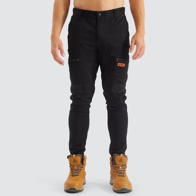 Model Wears Precision Slim Fit Pant Black Pants in Black - Image 7