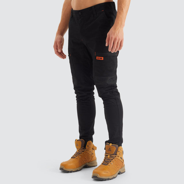 Model Wears Precision Slim Fit Pant Black Pants in Black - Image 8