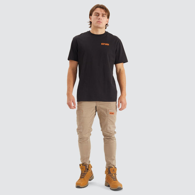 Model Wears Precision Slim Fit Pant Sand Pants in Beige - Image 3