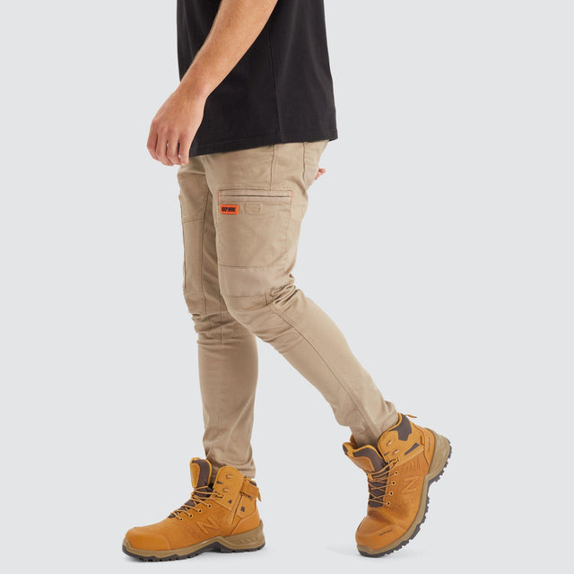 Model Wears Precision Slim Fit Pant Sand Pants in Beige - Image 5