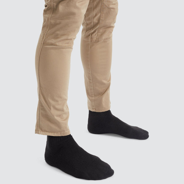 Model Wears Precision Slim Fit Pant Sand Pants in Beige - Image 11