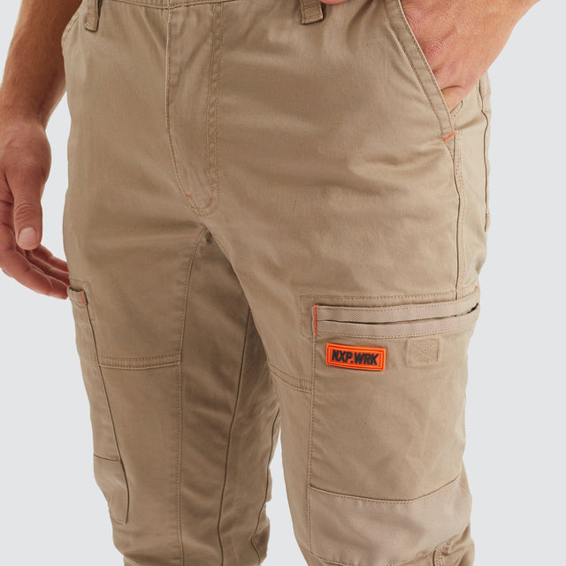Model Wears Precision Slim Fit Pant Sand Pants in Beige - Image 2