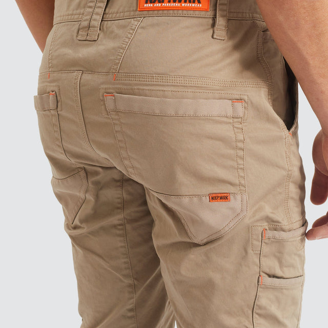 Model Wears Precision Slim Fit Pant Sand Pants in Beige - Image 8