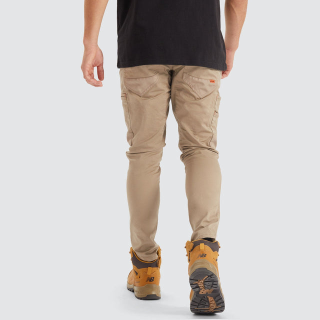 Model Wears Precision Slim Fit Pant Sand Pants in Beige - Image 7