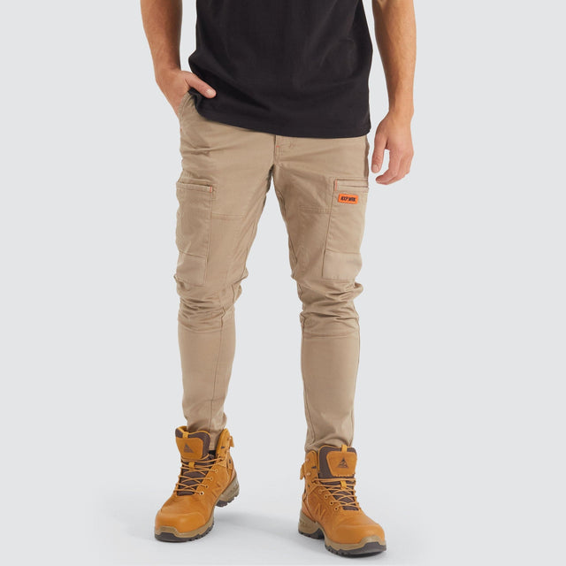 Model Wears Precision Slim Fit Pant Sand Pants in Beige - Image 1