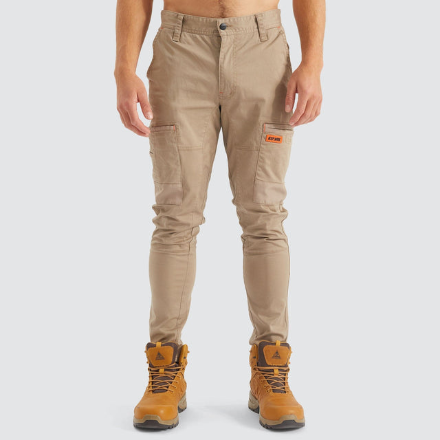 Model Wears Precision Slim Fit Pant Sand Pants in Beige - Image 9