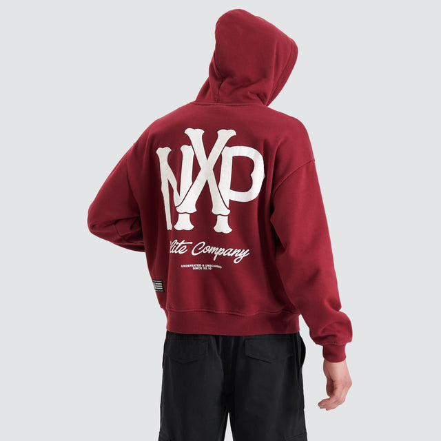 Model Wears Pursuits Heavy Box Fit Hooded Sweater Cabernet Hoodies in Red - Image 1