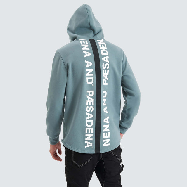 Model Wears Rectilinear Dual Curved Hoodie Goblin Blue Hoodies in Blue - Image 4