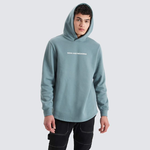 Model Wears Rectilinear Dual Curved Hoodie Goblin Blue Hoodies in Blue - Image 1