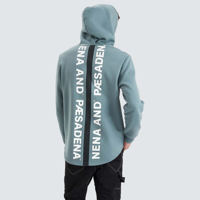 Model Wears Rectilinear Dual Curved Hoodie Goblin Blue Hoodies in Blue - Image 3