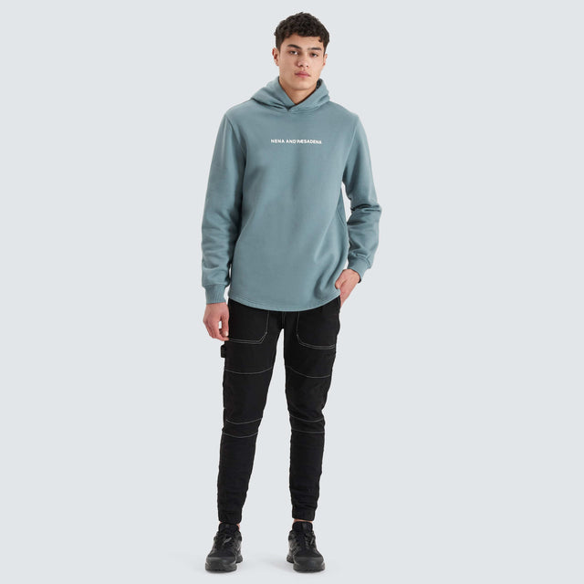 Model Wears Rectilinear Dual Curved Hoodie Goblin Blue Hoodies in Blue - Image 5