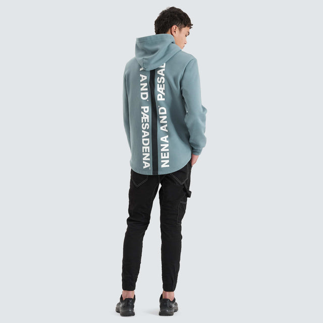 Model Wears Rectilinear Dual Curved Hoodie Goblin Blue Hoodies in Blue - Image 2