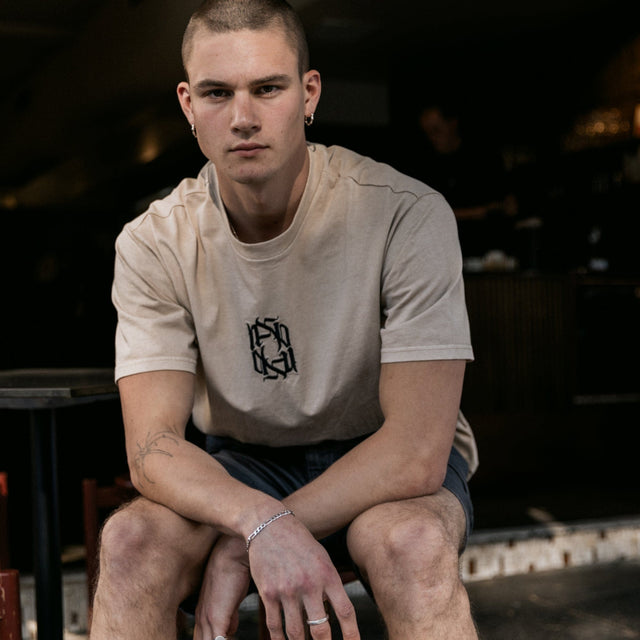 Model Wears Reminder Heavy Box Fit Scoop Tee Pigment Oxford Tan T-Shirts in Brown - Image 2