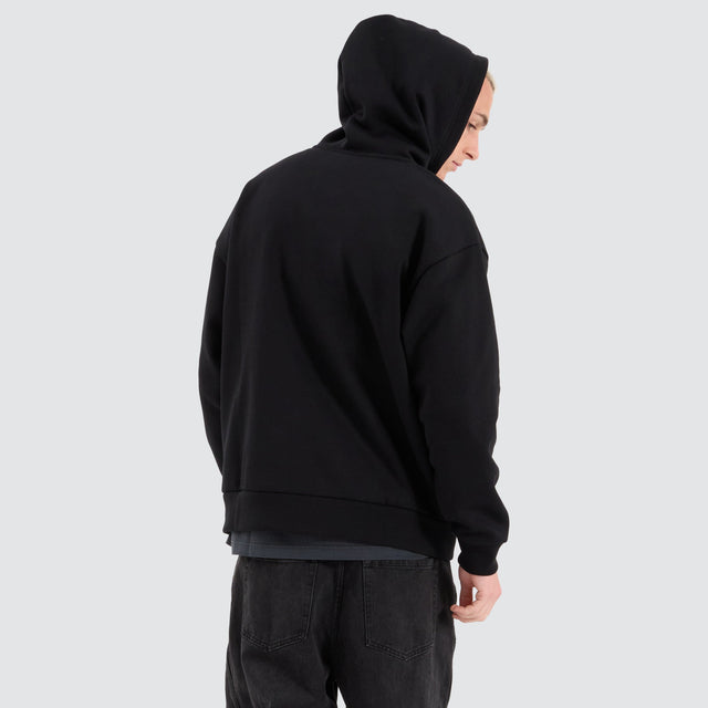 Model Wears Rosthern Relaxed Zip Through Hoodie Jet Black Jumpers in Black - Image 2