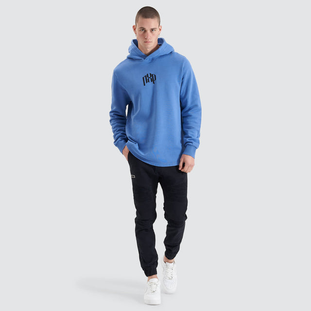 Model Wears Rubble Dual Curved Hoodie Pigment Dutch Blue Hoodies in Blue - Image 6