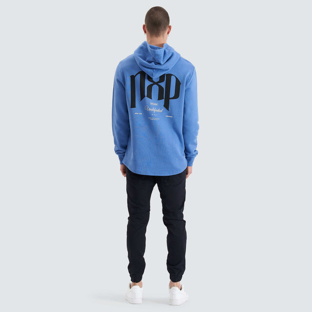 Model Wears Rubble Dual Curved Hoodie Pigment Dutch Blue Hoodies in Blue - Image 3