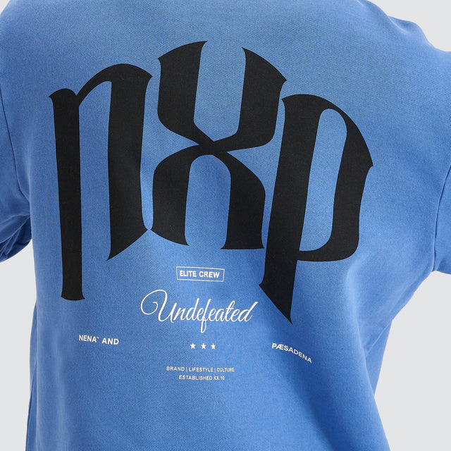 Model Wears Rubble Dual Curved Hoodie Pigment Dutch Blue Hoodies in Blue - Image 4