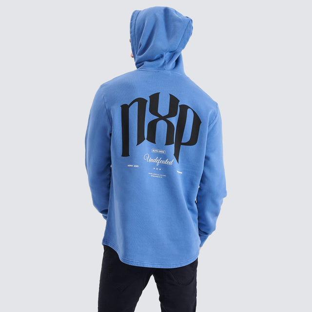 Model Wears Rubble Dual Curved Hoodie Pigment Dutch Blue Hoodies in Blue - Image 1
