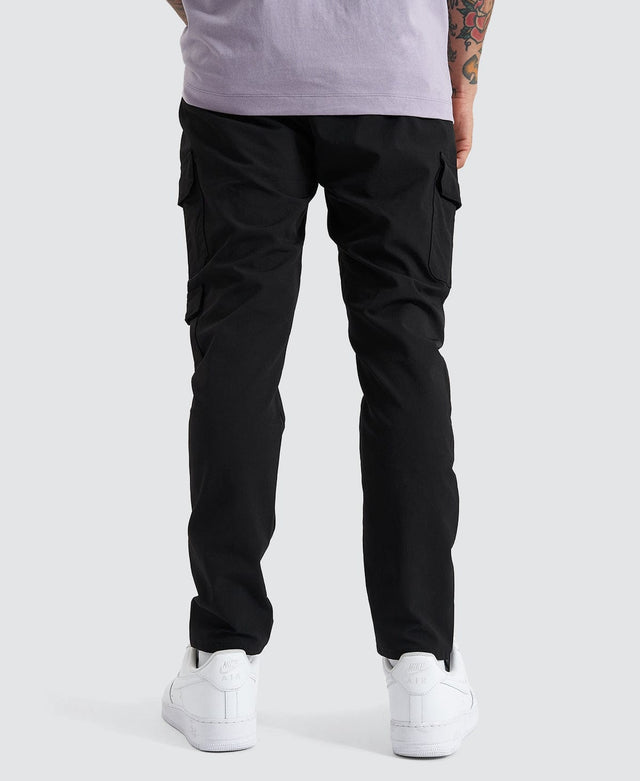 Model Wears S150 Slim Cargo Pant Black Pants in Black - Image 2