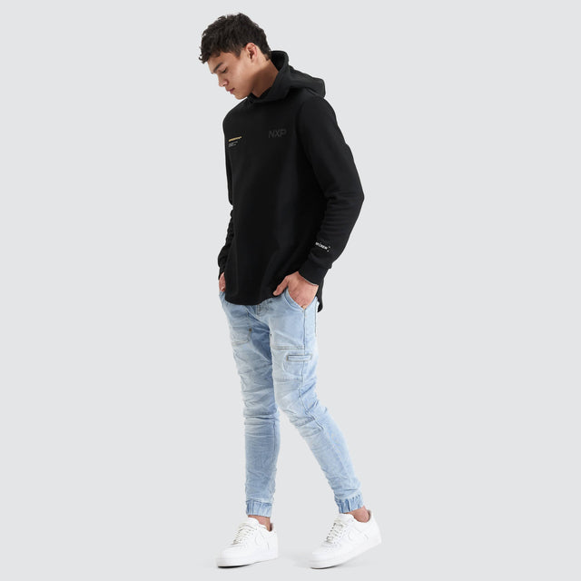 Model Wears Spire Dual Curved Hoodie Jet Black Hoodies in Black - Image 3