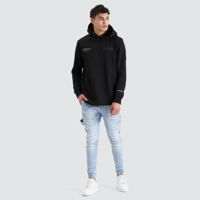 Model Wears Spire Dual Curved Hoodie Jet Black Hoodies in Black - Image 6
