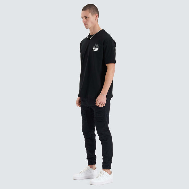 Model Wears Superstructure Heavy Box Fit Tee Jet Black T-Shirts in Black - Image 6