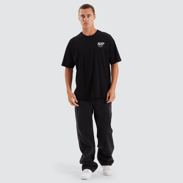 Model Wears Suspension Heavy Box Fit Tee Jet Black T-Shirts in Black - Image 2