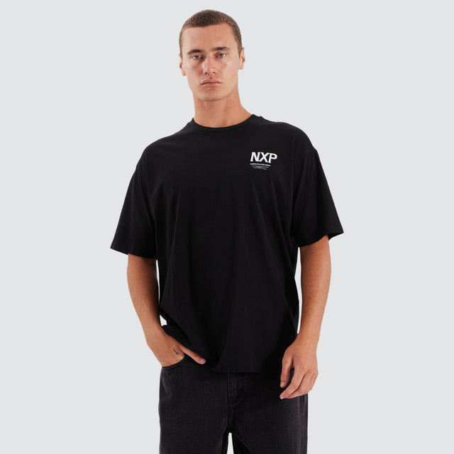 Model Wears Suspension Heavy Box Fit Tee Jet Black T-Shirts in Black - Image 4