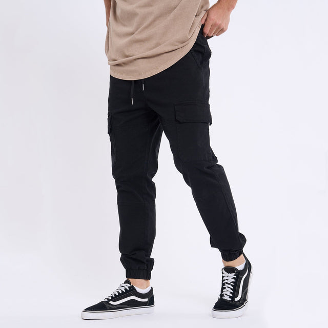 Model Wears Thundercat Jogger Black Pants in Black - Image 3