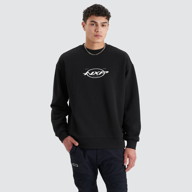 Model Wears Tracery Heavy Relaxed Jumper Jet Black Jumpers in Black - Image 1