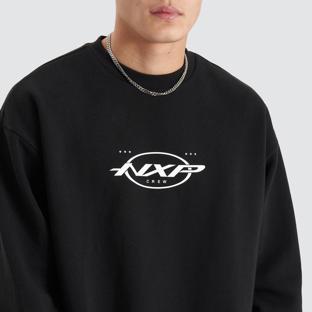 Model Wears Tracery Heavy Relaxed Jumper Jet Black Jumpers in Black - Image 3