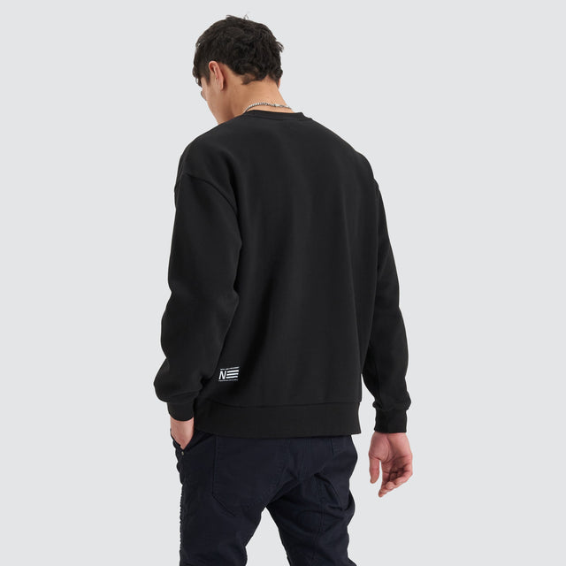 Model Wears Tracery Heavy Relaxed Jumper Jet Black Jumpers in Black - Image 2