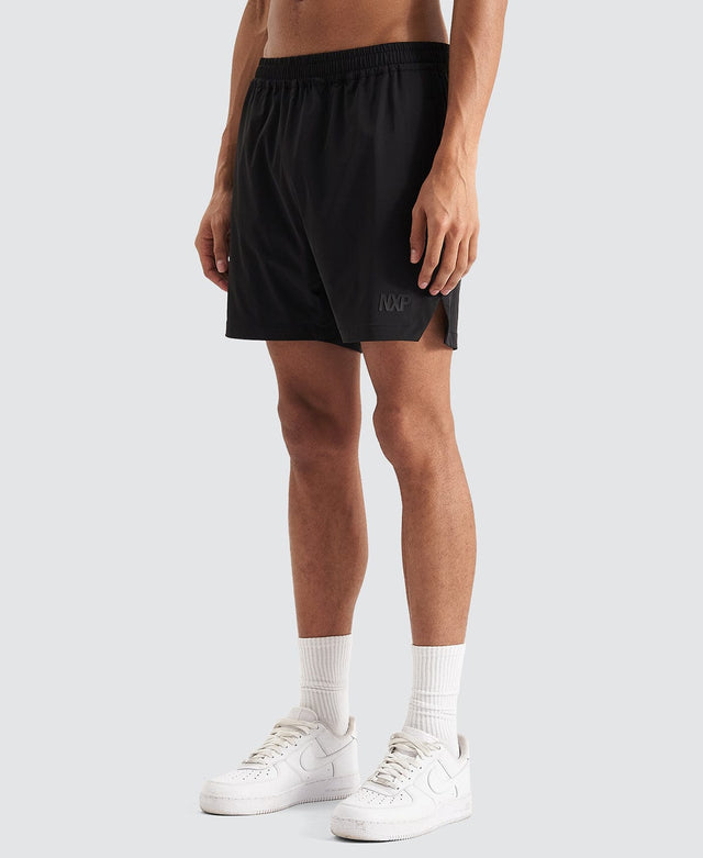 Model Wears Trigger Elastic Waist Shorts Jet Black Shorts in Black - Image 9