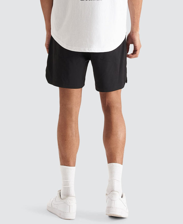 Model Wears Trigger Elastic Waist Shorts Jet Black Shorts in Black - Image 4