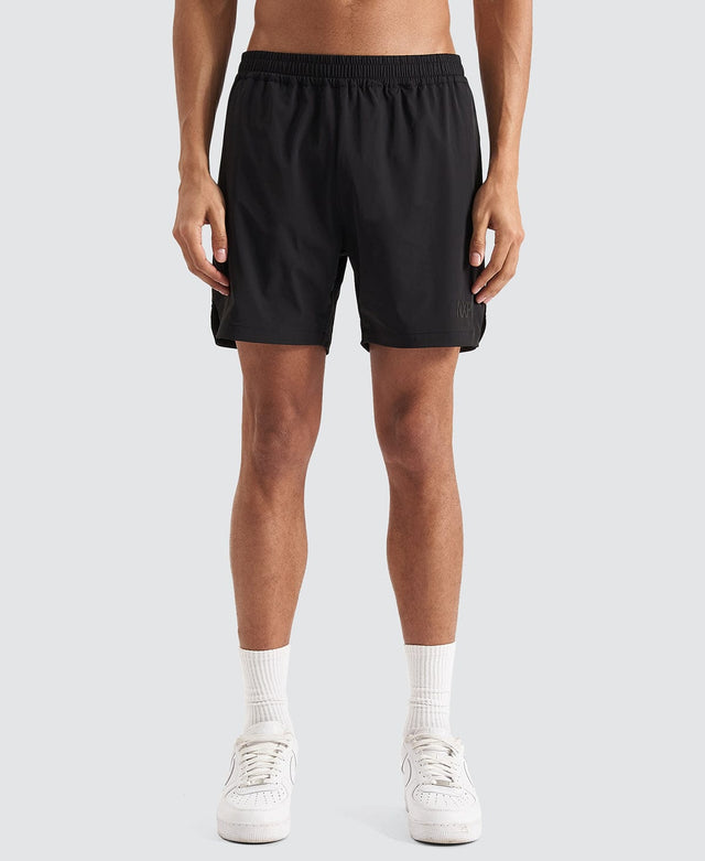 Model Wears Trigger Elastic Waist Shorts Jet Black Shorts in Black - Image 8