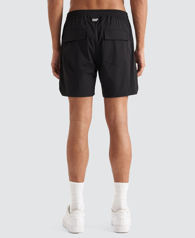 Model Wears Trigger Elastic Waist Shorts Jet Black Shorts in Black - Image 10