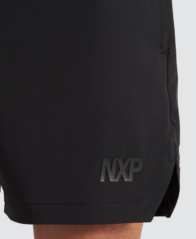 Model Wears Trigger Elastic Waist Shorts Jet Black Shorts in Black - Image 7