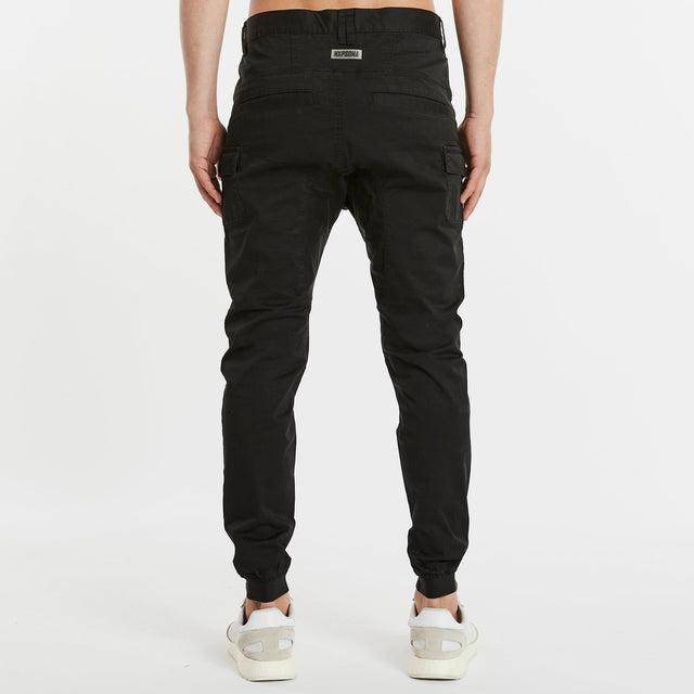 Model Wears Flight 2.0 Pant Black Pants in Black - Image 6
