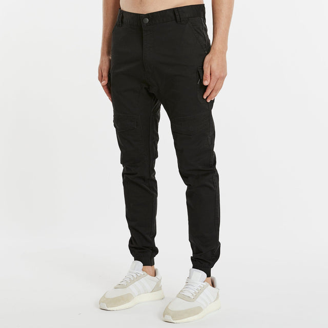 Model Wears Flight 2.0 Pant Black Pants in Black - Image 5