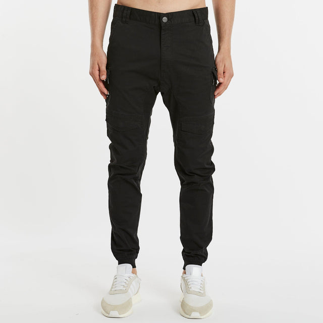 Model Wears Flight 2.0 Pant Black Pants in Black - Image 4