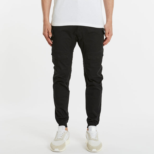 Model Wears Flight 2.0 Pant Black Pants in Black - Image 1