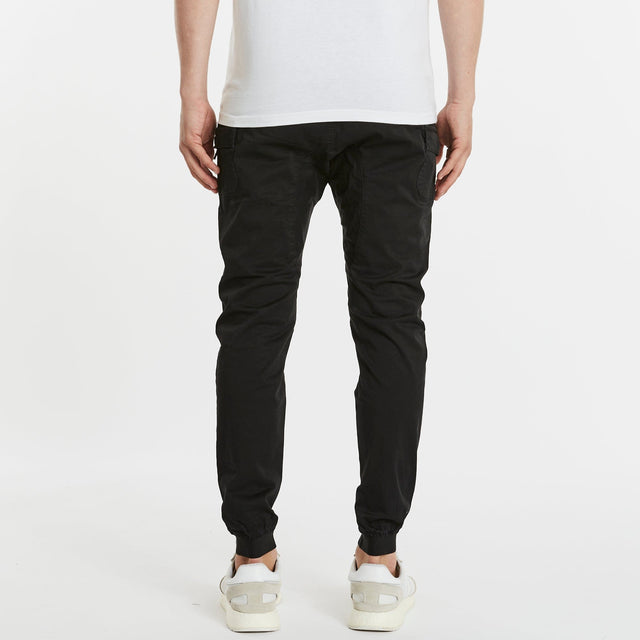 Model Wears Flight 2.0 Pant Black Pants in Black - Image 2