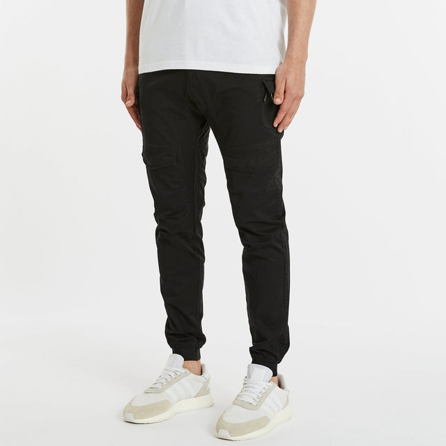 Model Wears Flight 2.0 Pant Black Pants in Black - Image 3