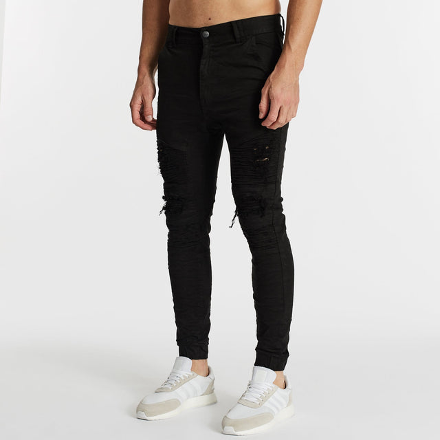 Model Wears Hellcat Pants Black Pants in Black - Image 5